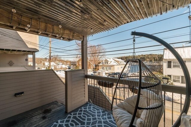 wooden deck featuring a residential view