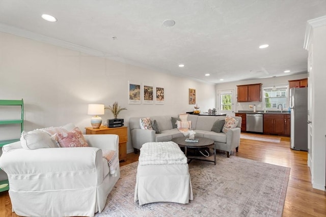 24 Merrimac Way Unit H, Tyngsborough, MA 01879 - living room with crown molding, recessed lighting, and light wood-style floors