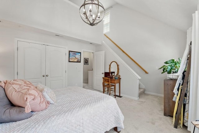 24 Merrimac Way Unit H, Tyngsborough, MA 01879 - bedroom featuring high vaulted ceiling, light carpet, a closet, a chandelier, and baseboards