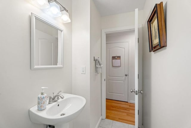 24 Merrimac Way Unit H, Tyngsborough, MA 01879 - bathroom featuring a sink, tile patterned floors, and baseboards