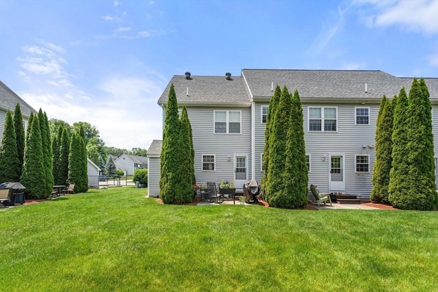 24 Merrimac Way Unit H, Tyngsborough, MA 01879 - rear view of house featuring a lawn, entry steps, and a patio area