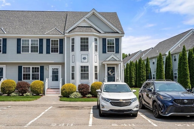 24 Merrimac Way Unit H, Tyngsborough, MA 01879 - view of property with uncovered parking and a shingled roof