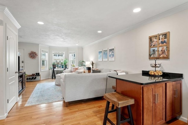 24 Merrimac Way Unit H, Tyngsborough, MA 01879 - living room featuring light wood finished floors, crown molding, recessed lighting, and baseboards