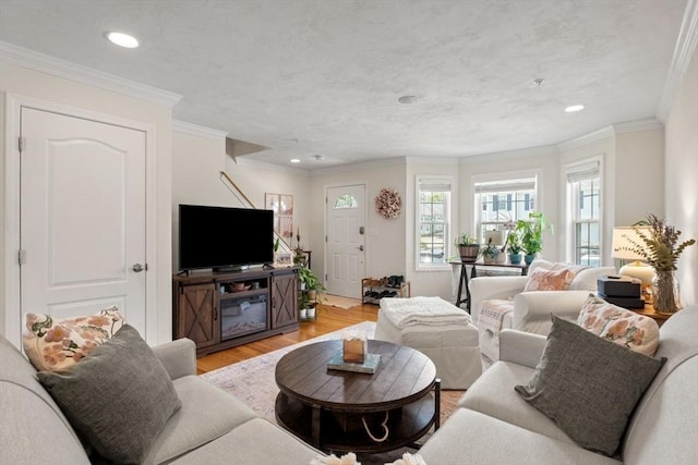 24 Merrimac Way Unit H, Tyngsborough, MA 01879 - living area with light wood-style floors, recessed lighting, and crown molding