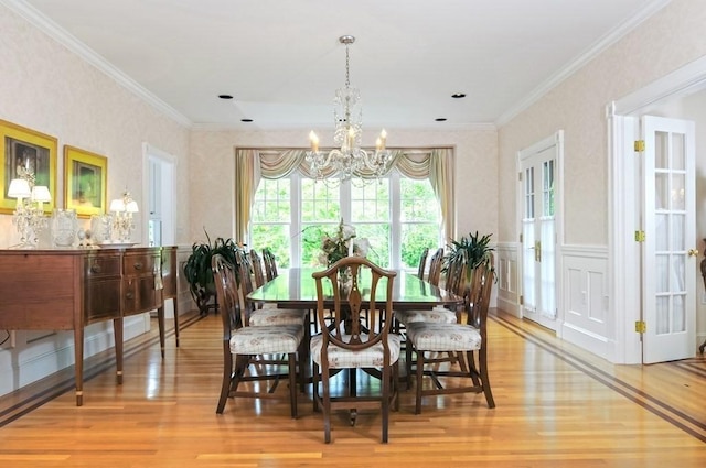 0 Gulf Rd, Dartmouth, MA 02748 - dining area featuring a chandelier, wood finished floors, crown molding, and wainscoting
