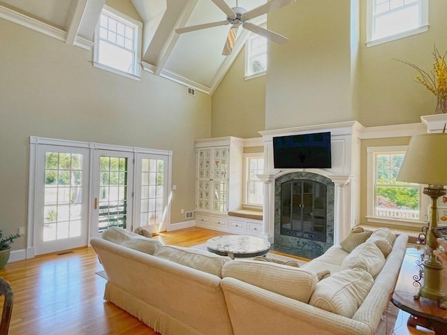 0 Gulf Rd, Dartmouth, MA 02748 - living room with high vaulted ceiling, a ceiling fan, light wood-style floors, plenty of natural light, and a high end fireplace