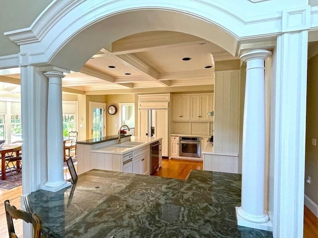 0 Gulf Rd, Dartmouth, MA 02748 - kitchen with ornate columns, stainless steel appliances, arched walkways, coffered ceiling, and ornamental molding