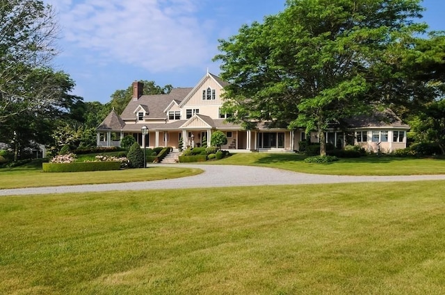 0 Gulf Rd, Dartmouth, MA 02748 - view of front of home with a front yard, a chimney, and curved driveway