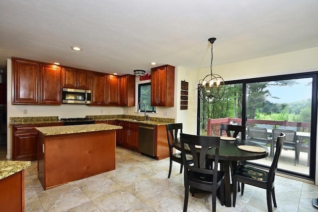 21 Hunt Dr, Stoughton, MA 02072 - kitchen with appliances with stainless steel finishes, a chandelier, light stone counters, a kitchen island, and decorative light fixtures