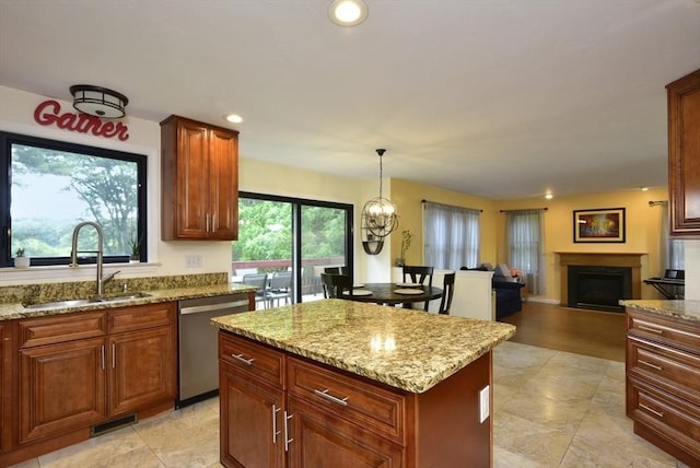 21 Hunt Dr, Stoughton, MA 02072 - kitchen with dishwasher, light stone countertops, a fireplace, a kitchen island, and recessed lighting