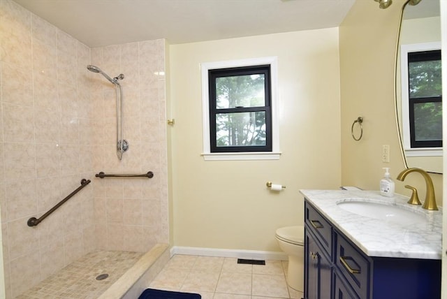 21 Hunt Dr, Stoughton, MA 02072 - full bath with tile patterned flooring, a tile shower, vanity, and plenty of natural light