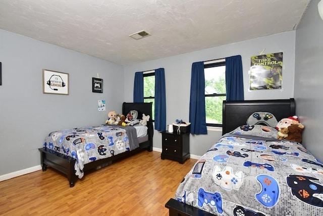 21 Hunt Dr, Stoughton, MA 02072 - bedroom with light wood-type flooring and baseboards