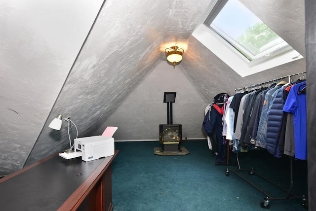 21 Hunt Dr, Stoughton, MA 02072 - additional living space with lofted ceiling, a skylight, a wood stove, and carpet