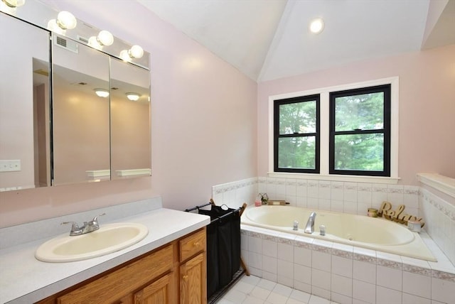 21 Hunt Dr, Stoughton, MA 02072 - full bathroom with vanity, a whirlpool tub, vaulted ceiling, and tile patterned floors