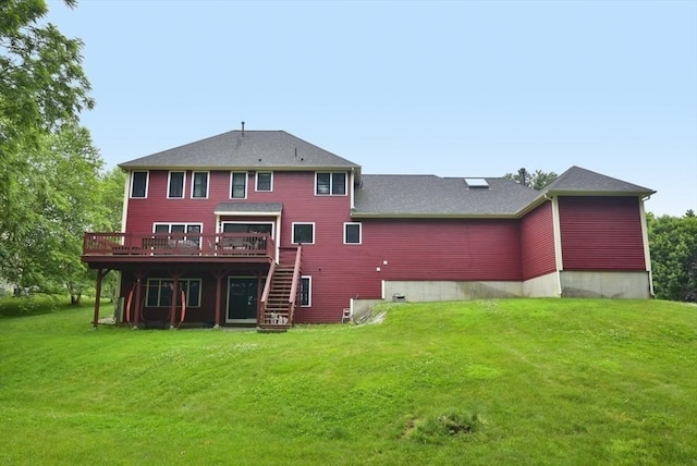 21 Hunt Dr, Stoughton, MA 02072 - back of house with a deck, stairs, and a lawn