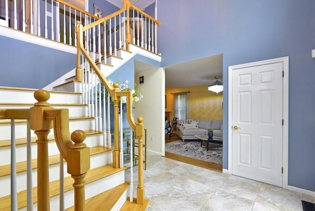 21 Hunt Dr, Stoughton, MA 02072 - stairway with a towering ceiling and baseboards