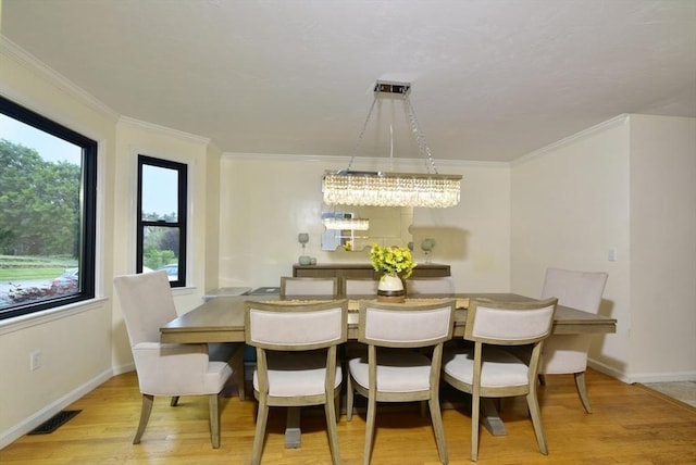 21 Hunt Dr, Stoughton, MA 02072 - dining room featuring light wood-style flooring and ornamental molding