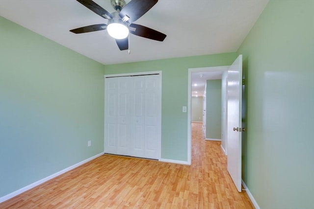 3 Concord Greene Unit 4, Concord, MA 01742 - unfurnished bedroom with light wood finished floors, baseboards, a closet, and ceiling fan