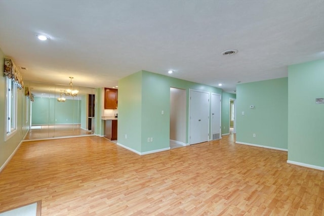 3 Concord Greene Unit 4, Concord, MA 01742 - unfurnished room featuring light wood-style flooring, baseboards, a chandelier, and recessed lighting