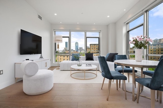 700 Harrison Ave Unit Ph-610, Boston, MA 02118 - living room featuring healthy amount of natural light, wood finished floors, baseboards, and recessed lighting