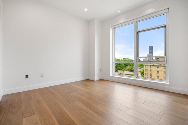 700 Harrison Ave Unit Ph-610, Boston, MA 02118 - unfurnished room with baseboards, light wood finished floors, and recessed lighting