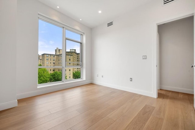 700 Harrison Ave Unit Ph-610, Boston, MA 02118 - unfurnished room featuring baseboards, light wood-style flooring, and recessed lighting