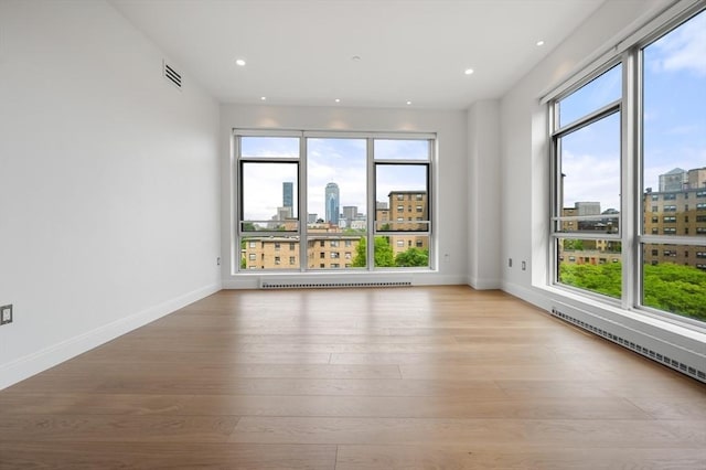 700 Harrison Ave Unit Ph-610, Boston, MA 02118 - spare room featuring a city view, plenty of natural light, light wood-type flooring, and recessed lighting