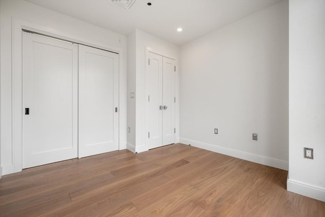 700 Harrison Ave Unit Ph-610, Boston, MA 02118 - unfurnished bedroom featuring baseboards, light wood-style flooring, and recessed lighting