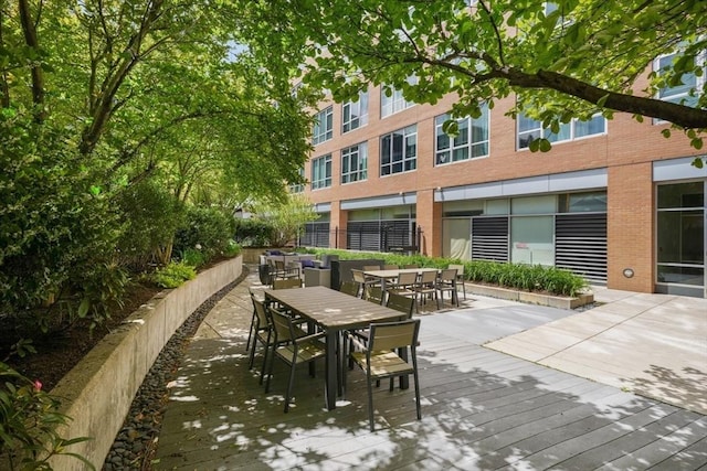 700 Harrison Ave Unit Ph-610, Boston, MA 02118 - view of patio / terrace with outdoor dining space and a wooden deck