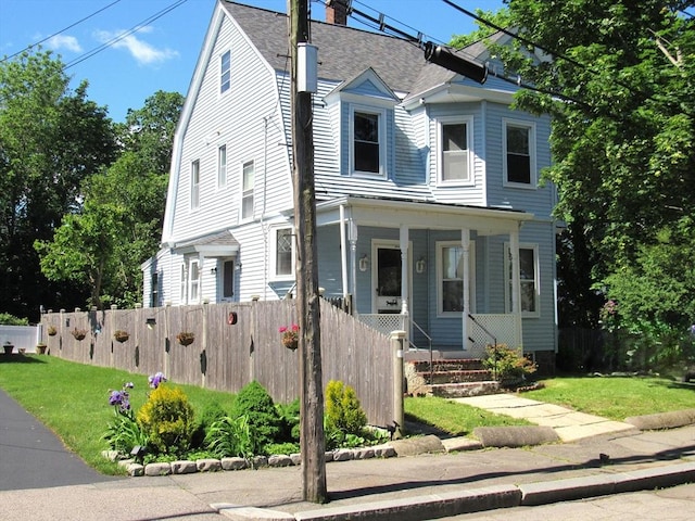 31 Graham St, Quincy, MA 02169 - view of front of property with a porch, a chimney, and roof with shingles