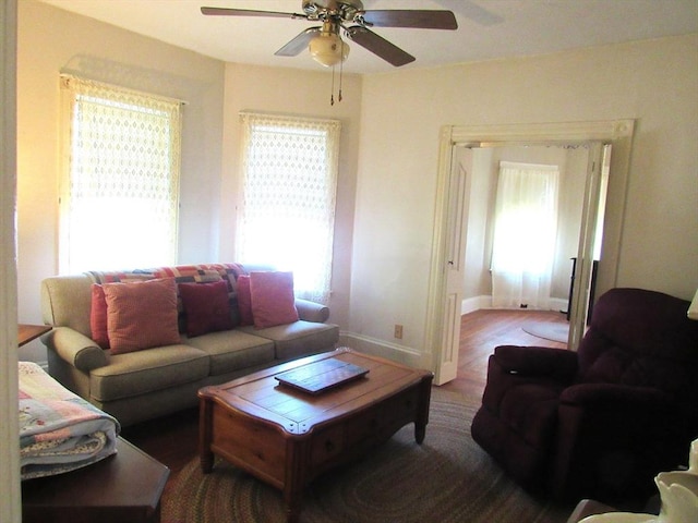 31 Graham St, Quincy, MA 02169 - living area with a ceiling fan, healthy amount of natural light, wood finished floors, and baseboards