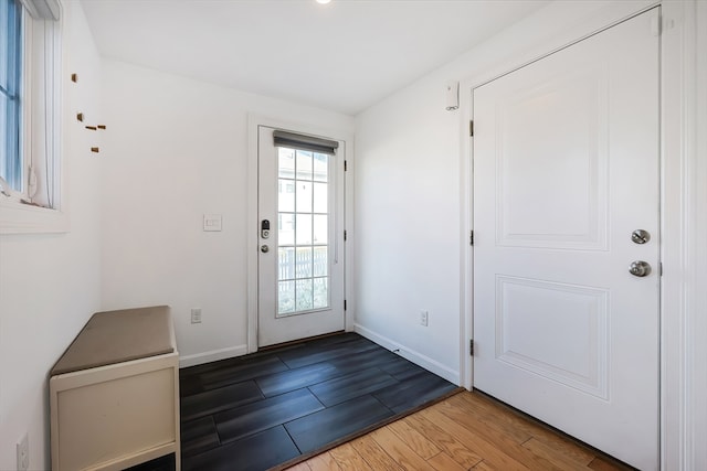 doorway with wood-type flooring