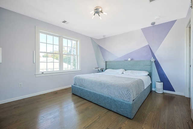 bedroom featuring dark hardwood / wood-style floors