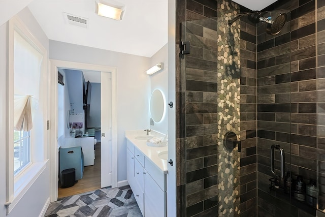 bathroom featuring vanity, a shower with shower door, and wood-type flooring