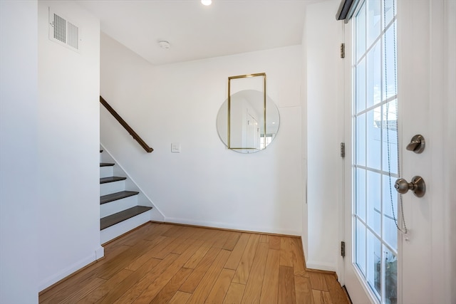 entryway with light hardwood / wood-style floors