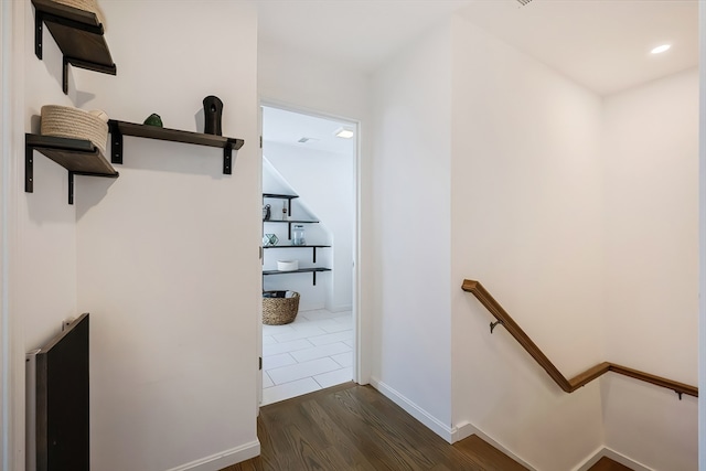 hallway with dark wood-type flooring