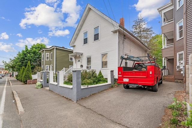 56 N Warren Ave, Brockton, MA 02301 - townhome / multi-family property featuring a chimney