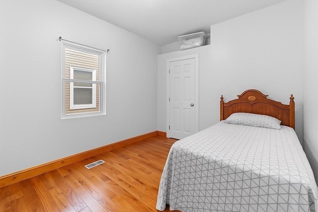 56 N Warren Ave, Brockton, MA 02301 - bedroom with light wood-style floors and baseboards