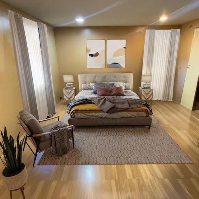 bedroom with wood-type flooring