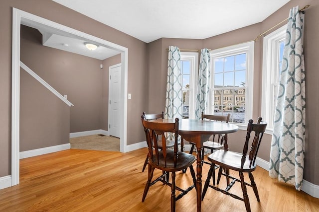 dining space featuring light hardwood / wood-style flooring