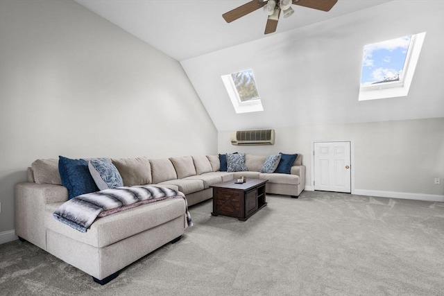 living room with a wall mounted AC, carpet, vaulted ceiling with skylight, and ceiling fan