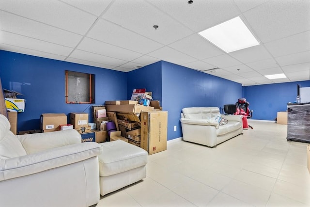 living room with a paneled ceiling