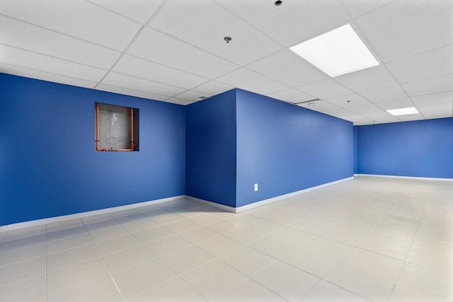 unfurnished room featuring a paneled ceiling