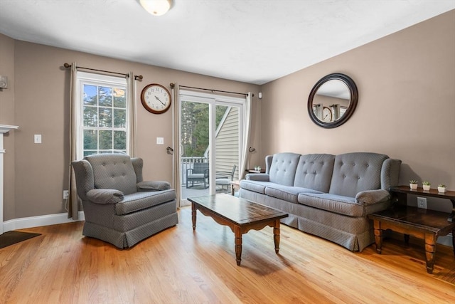 living room with plenty of natural light and light wood-type flooring