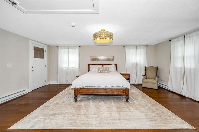 7 Washington St, Groveland, MA 01834 - bedroom featuring dark wood finished floors and baseboard heating