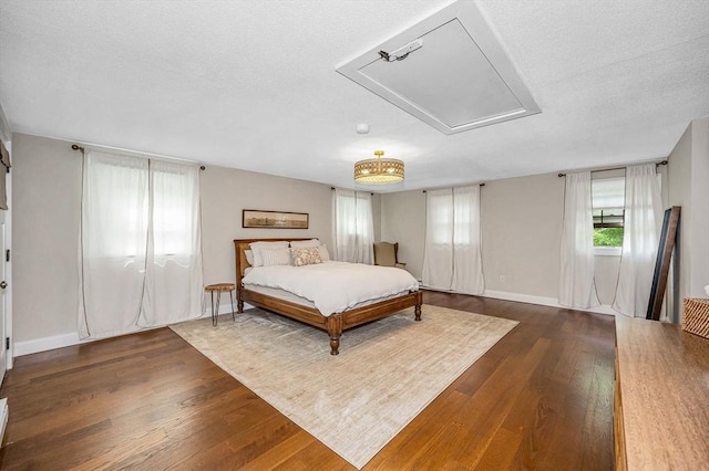 7 Washington St, Groveland, MA 01834 - bedroom with attic access and dark wood-style floors