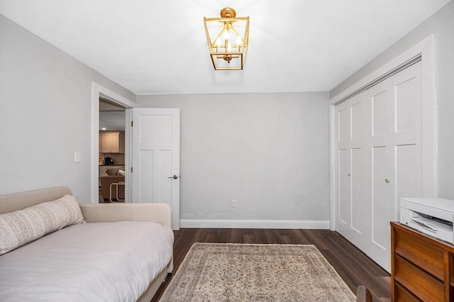 7 Washington St, Groveland, MA 01834 - bedroom with dark wood finished floors, a chandelier, and a closet
