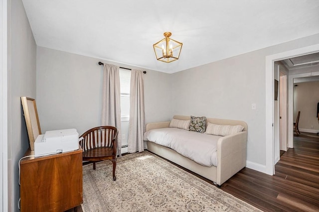 7 Washington St, Groveland, MA 01834 - bedroom featuring wood finished floors, attic access, baseboard heating, and a chandelier