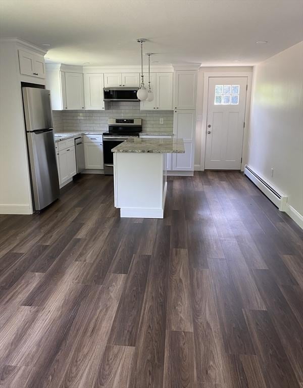 7 Washington St, Groveland, MA 01834 - kitchen with appliances with stainless steel finishes, a baseboard radiator, extractor fan, and white cabinetry