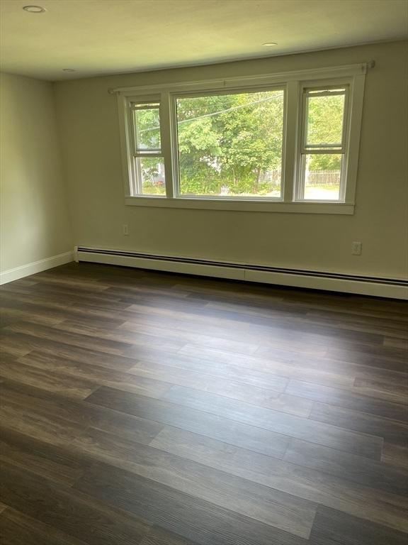 7 Washington St, Groveland, MA 01834 - spare room with baseboard heating, plenty of natural light, dark wood-type flooring, and recessed lighting